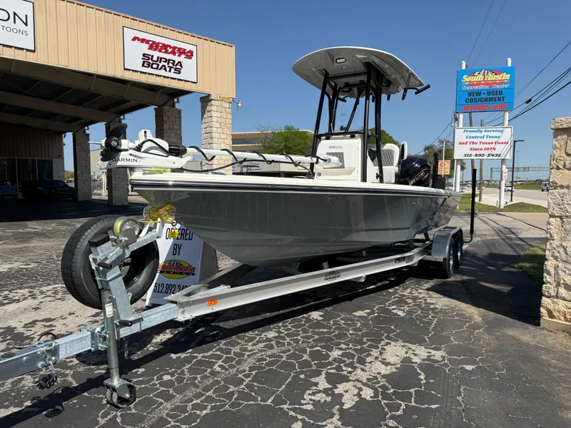 Slide: The Image of 2025 Pathfinder 2300 HPS boat on trailer at dealership, sunny day. - 14