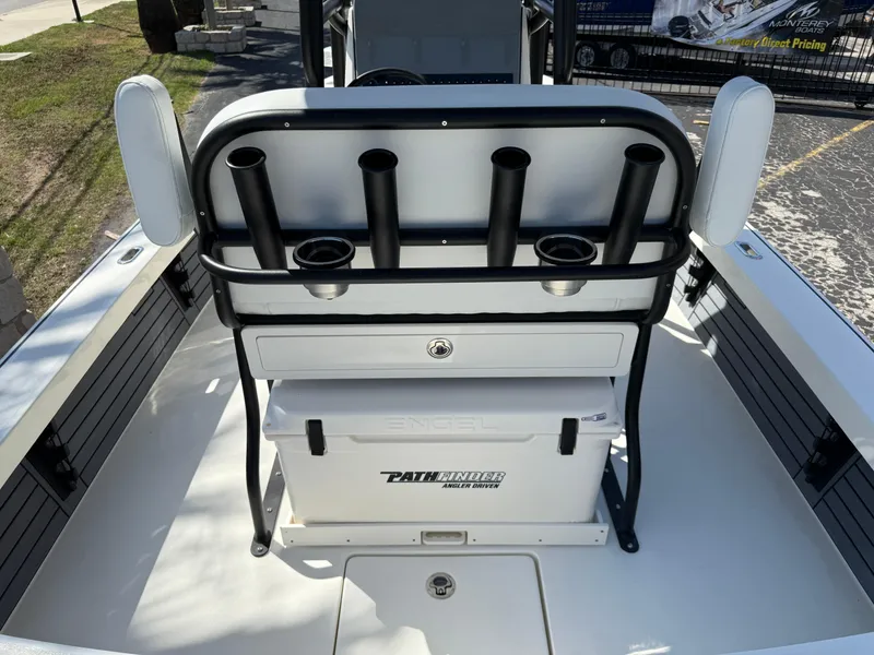 Slide: The Image of 2025 Pathfinder 2300 HPS boat interior with rod holders and storage compartment. - 16