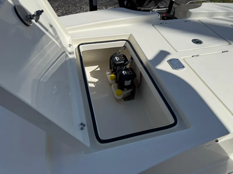 Slide: The Image of 2025 Pathfinder 2300 HPS boat storage compartment with batteries and secure hatch. - 23