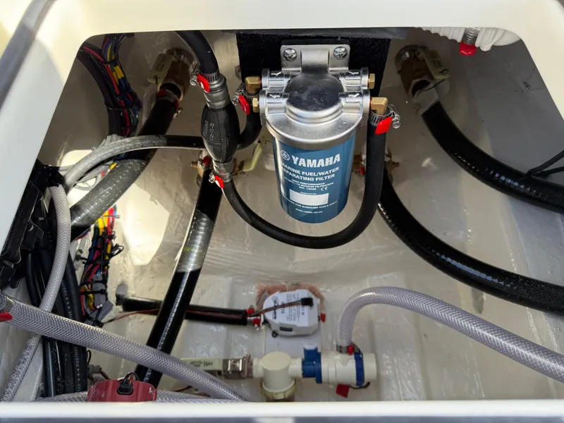 Slide: The Image of Engine compartment of 2025 Pathfinder 2300 HPS boat with Yamaha fuel filter. - 28