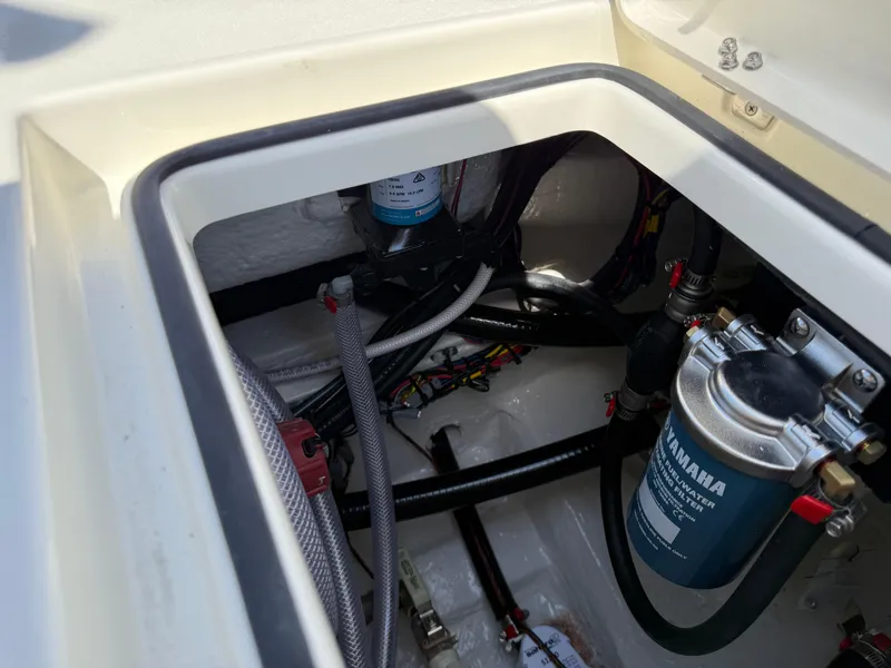 Slide: The Image of 2025 Pathfinder 2300 HPS boat engine compartment with Yamaha components and wiring. - 32