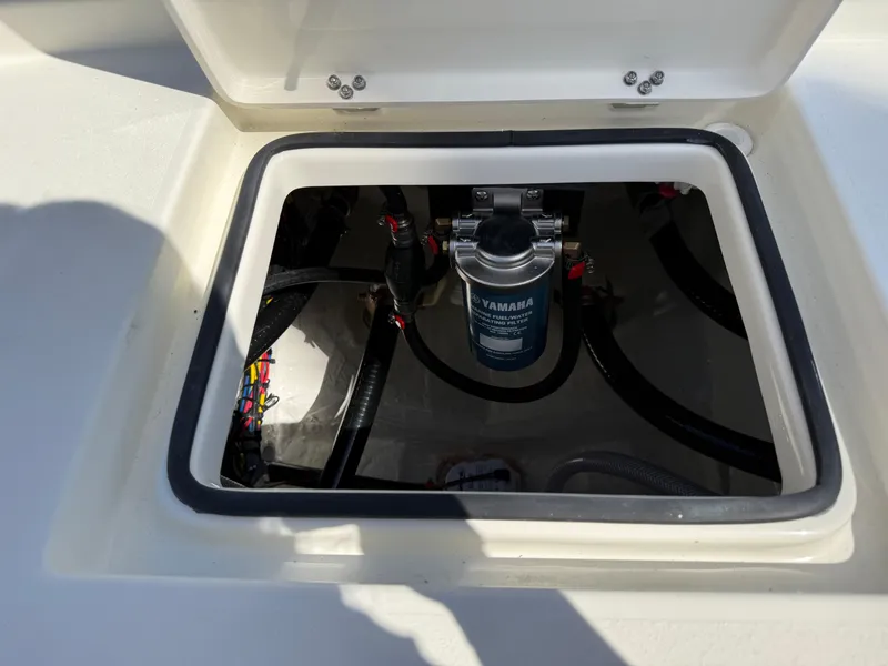 Slide: The Image of Open hatch of 2025 Pathfinder 2300 HPS boat showing internal components. - 33