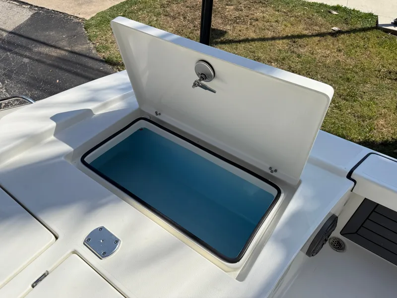 Slide: The Image of Open storage compartment on 2025 Pathfinder 2300 HPS boat, showcasing interior space. - 36