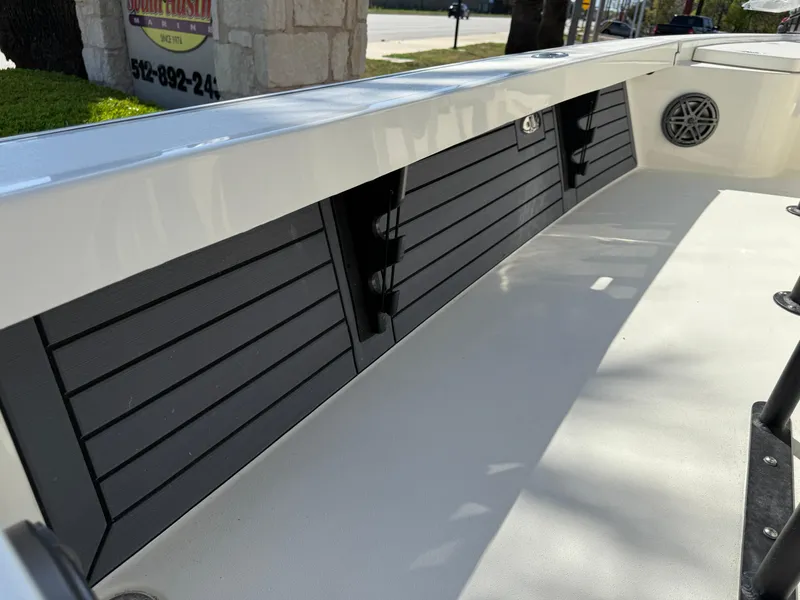 Slide: The Image of 2025 Pathfinder 2300 HPS boat interior with sleek storage compartments and speaker. - 37