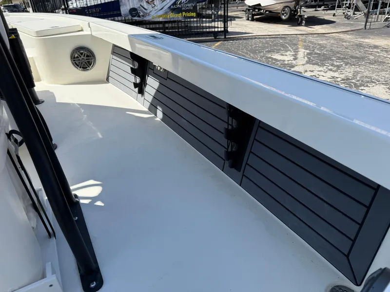 Slide: The Image of 2025 Pathfinder 2300 HPS boat interior with storage compartments and speaker. - 38