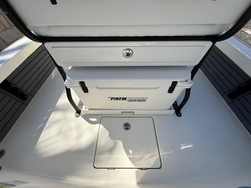 Slide: The Image of 2025 Pathfinder 2300 HPS boat interior with Engel cooler and storage compartment. - 41
