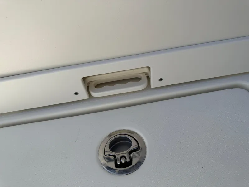 Slide: The Image of 2025 Pathfinder 2300 HPS boat hatch detail with handle and latch. - 46
