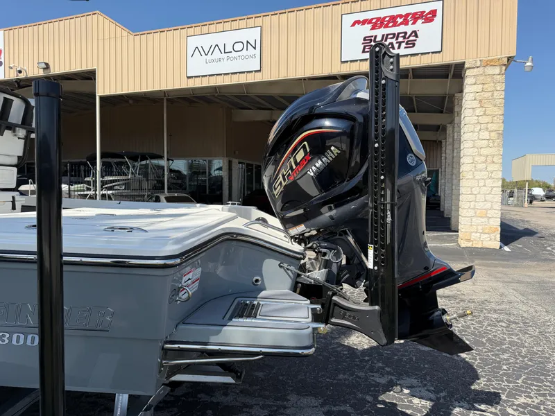 Slide: The Image of 2025 Pathfinder 2300 HPS boat with Yamaha engine at dealership. - 7