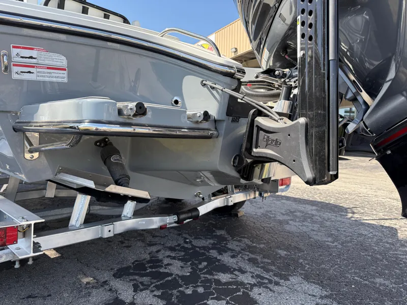 Slide: The Image of 2025 Pathfinder 2300 HPS boat on trailer, rear view showing motor mount and hull details. - 8