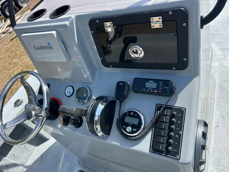 Slide: The Image of 2022 May-Craft 25 Hancock Edition boat console with Garmin system and marine controls. - 8