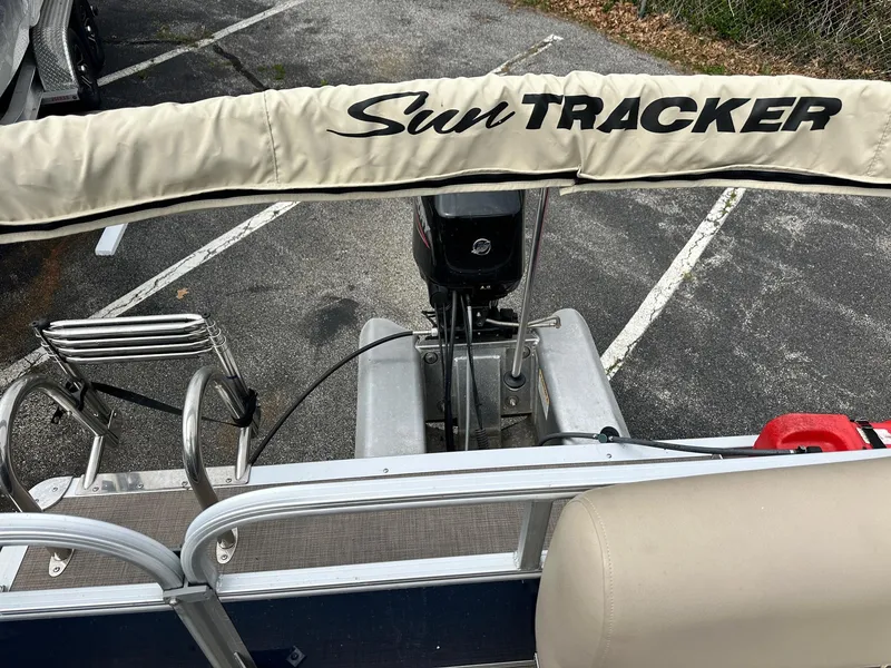 Slide: The Image of 2023 Sun Tracker Bass Buggy 16 XL Select pontoon boat with motor and ladder. - 12