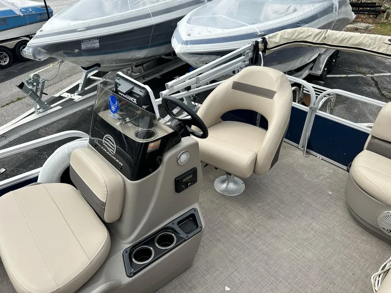 Slide: The Image of 2023 Sun Tracker Bass Buggy 16 XL Select pontoon boat interior with seating and steering console. - 14