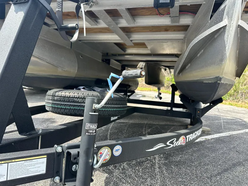 Slide: The Image of 2023 Sun Tracker Bass Buggy 16 XL Select pontoon boat on trailer, underside view. - 19