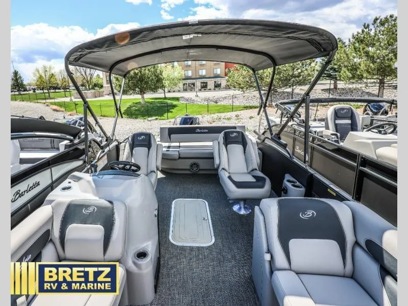 Slide: The Image of 2025 Aria Ultra-Lounge A22UC pontoon boat with spacious seating and canopy, displayed at Bretz RV & Marine. - 19