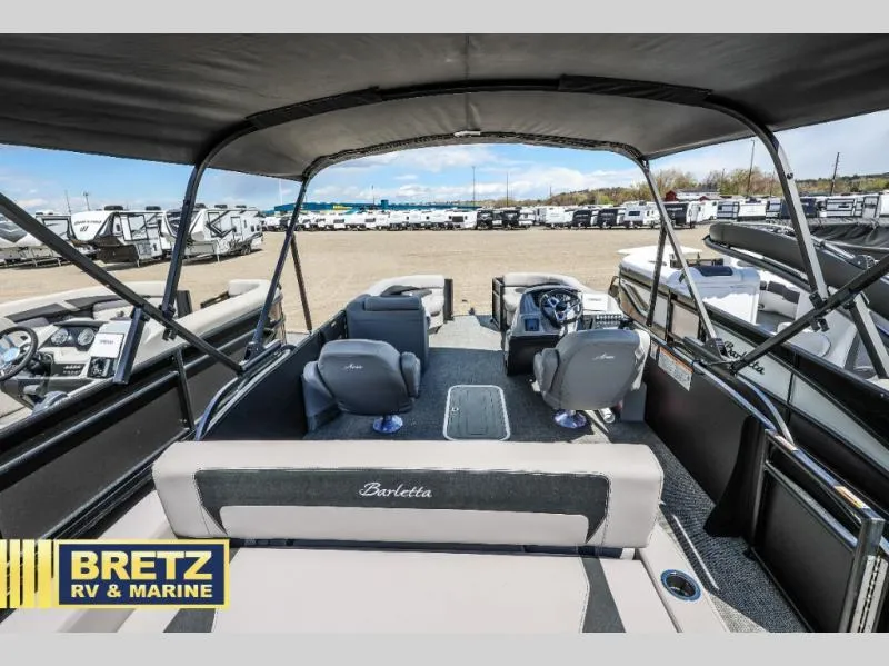 Slide: The Image of 2025 Aria Ultra-Lounge A22UC boat interior at Bretz RV & Marine dealership. - 9