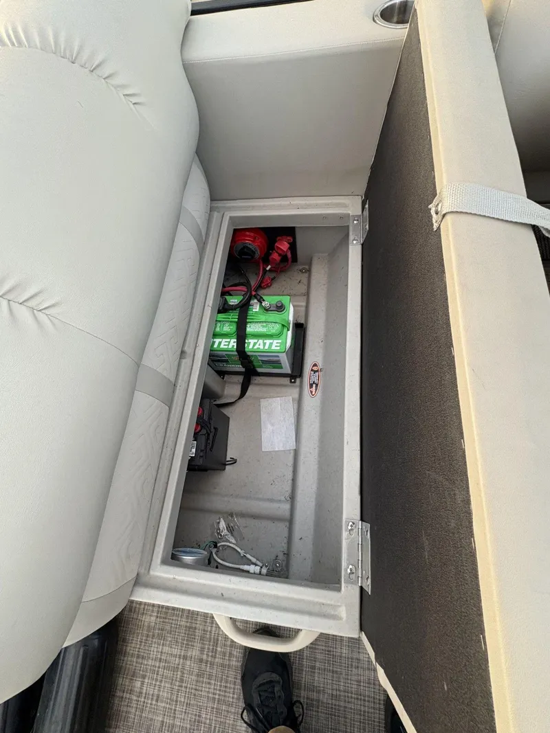 Slide: The Image of 2018 Cypress Cay Seabreeze 233 boat seat storage with battery compartment. - 16