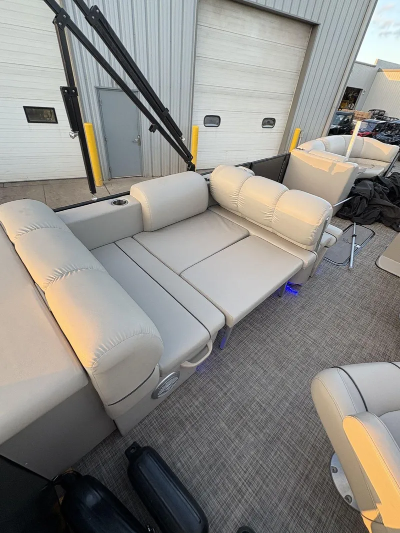 Slide: The Image of 2018 Cypress Cay Seabreeze 233 pontoon boat with beige seating and spacious deck area. - 28