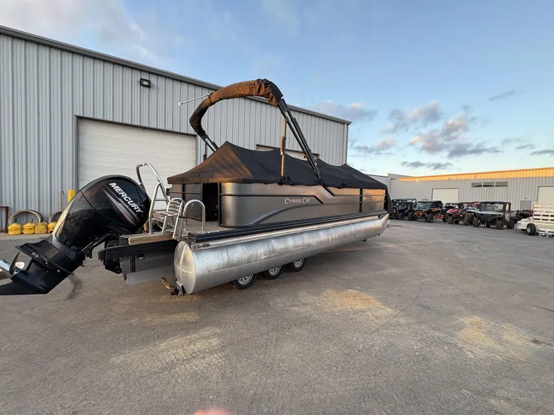 Slide: The Image of 2018 Cypress Cay Seabreeze 233 pontoon boat with Mercury engine, parked outdoors. - 3