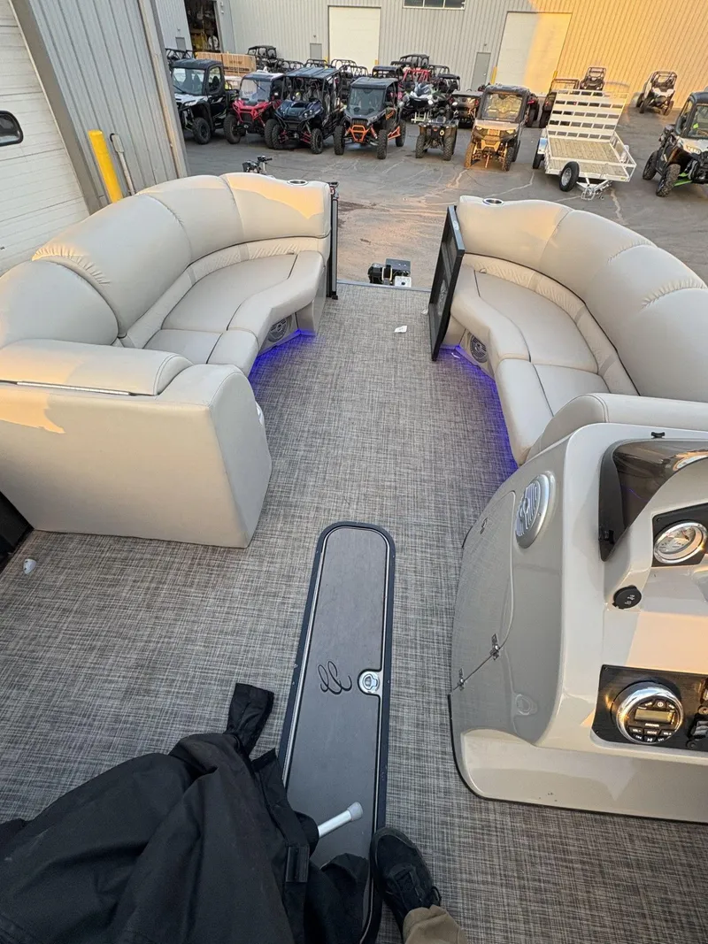 Slide: The Image of 2018 Cypress Cay Seabreeze 233 pontoon boat interior with plush seating and modern dashboard. - 31
