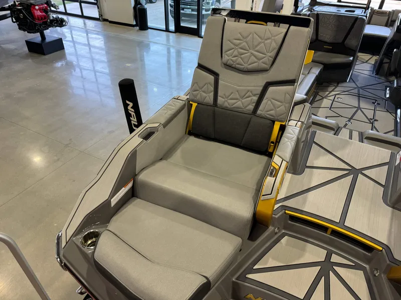 Slide: The Image of 2024 Nautique Super Air Nautique G25 Paragon interior seating with modern design and detailing. - 12