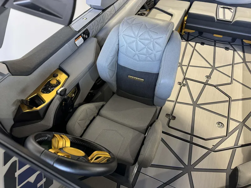 Slide: The Image of 2024 Nautique Super Air Nautique G25 Paragon interior with luxury seating and modern controls. - 21