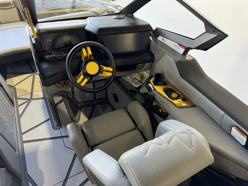 Slide: The Image of 2024 Nautique Super Air Nautique G25 Paragon cockpit with luxurious seating and modern controls. - 25