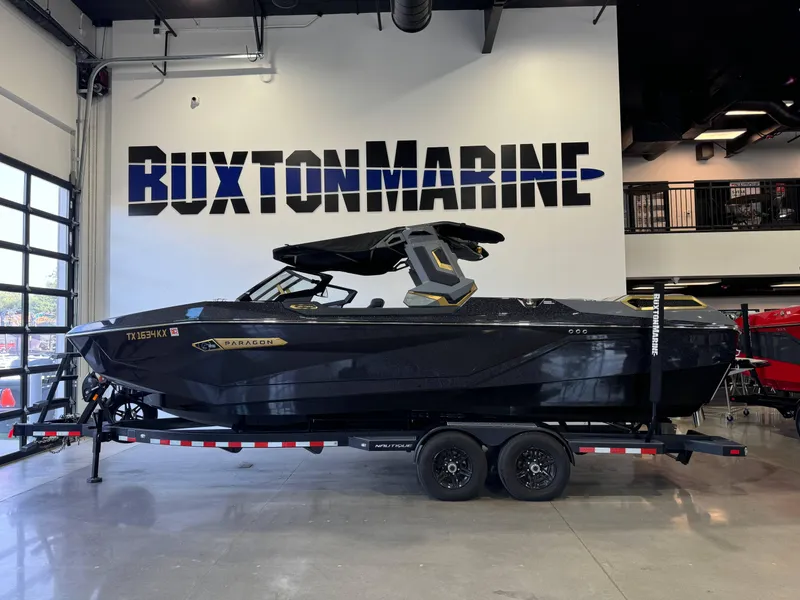Slide: The Image of 2024 Nautique Super Air Nautique G25 Paragon boat displayed at Buxton Marine showroom. - 4