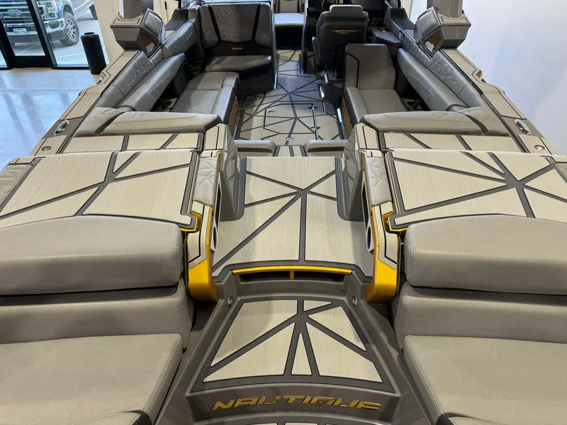 Slide: The Image of 2024 Nautique Super Air Nautique G25 Paragon interior with luxurious seating and modern design. - 7