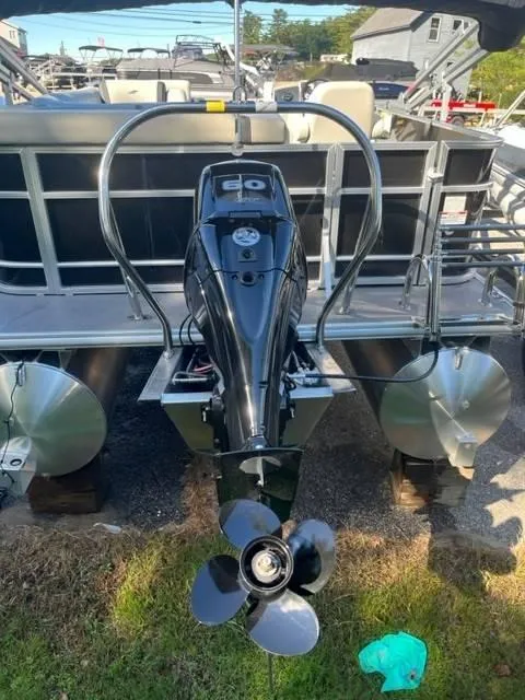 Slide: The Image of 2023 Starcraft EX 20C pontoon boat with powerful outboard motor, rear view. - 5
