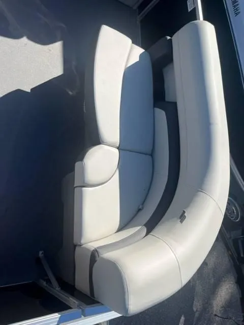 Slide: The Image of Curved seating on 2023 Starcraft EX 20C boat, featuring light gray upholstery. - 7