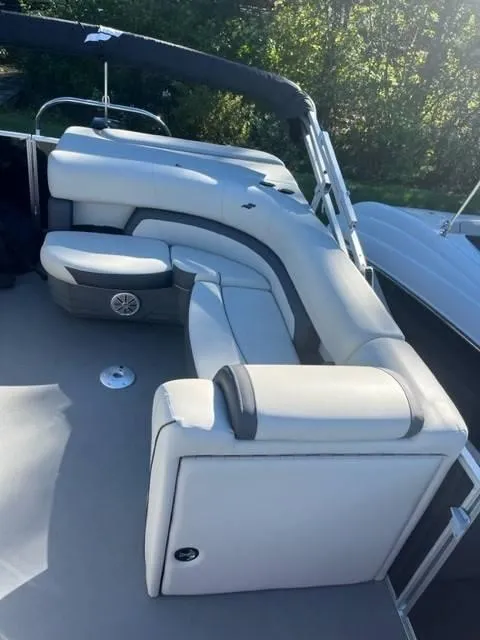 Slide: The Image of 2023 Starcraft EX 20C boat with sleek seating and modern design. - 9