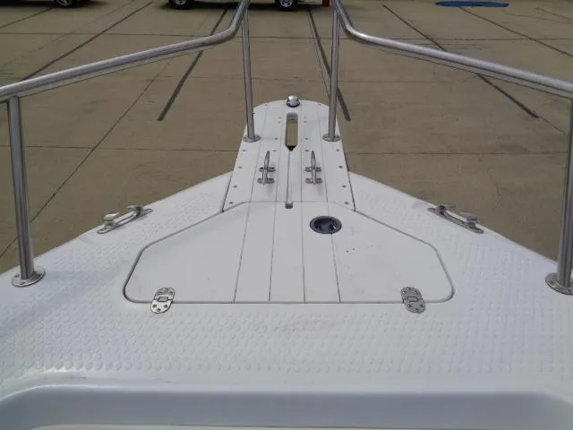 Slide: The Image of 2008 Triumph 215 CC boat deck with stainless steel railings. - 10