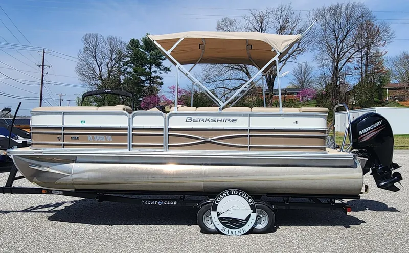 Slide: The Image of 2018 Berkshire 22CL CTS pontoon boat with canopy on trailer, side view. - 0
