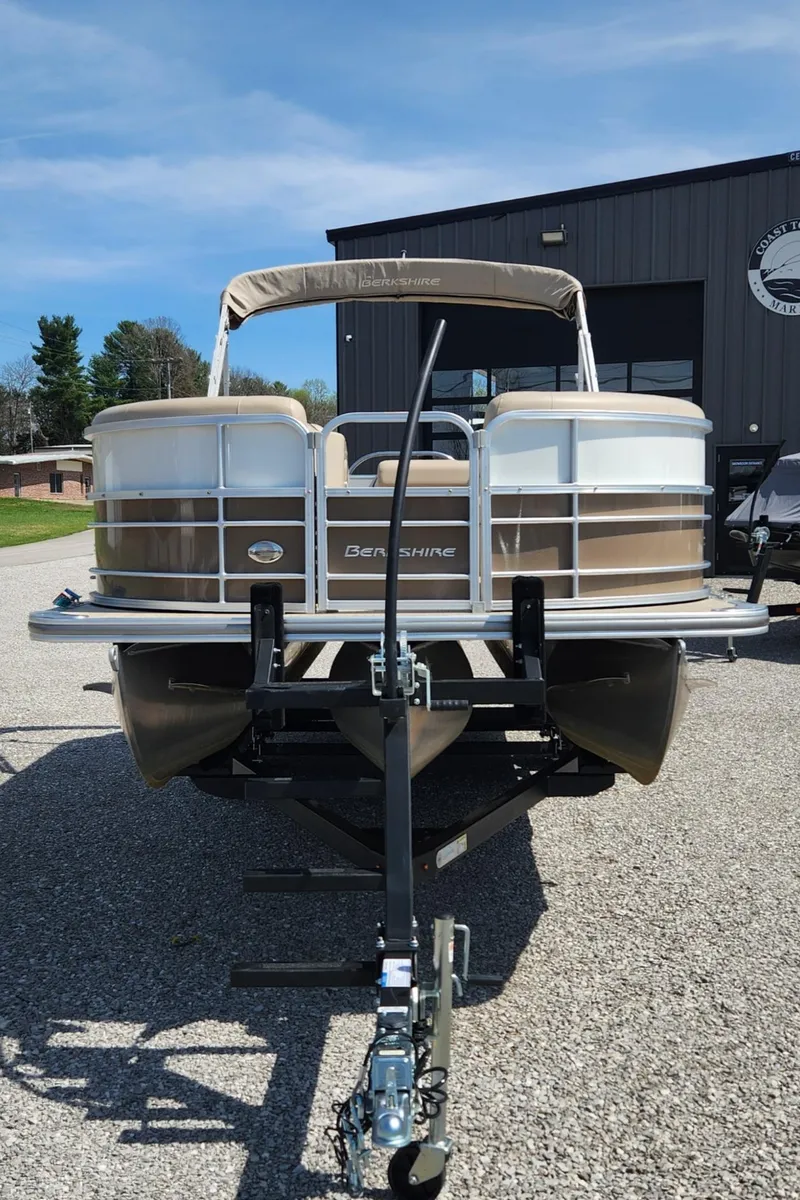 Slide: The Image of 2018 Berkshire 22CL CTS pontoon boat on trailer, parked outdoors. - 2