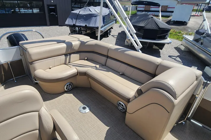 Slide: The Image of 2018 Berkshire 22CL CTS pontoon boat with beige seating and spacious deck layout. - 6