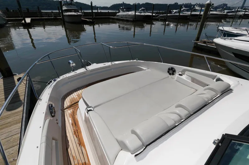 Slide: The Image of 2020 Sea Ray Sundancer 320 yacht with spacious sunbathing deck at marina. - 14