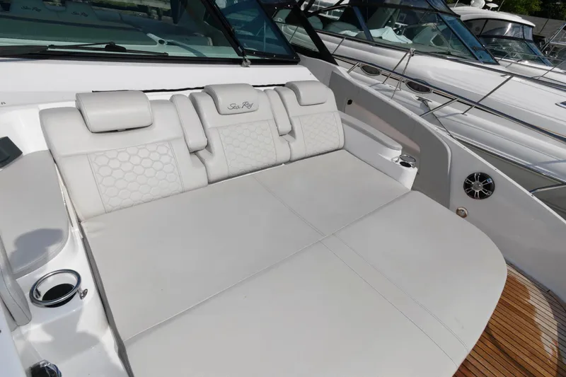 Slide: The Image of 2020 Sea Ray Sundancer 320 boat with luxurious white seating area. - 15