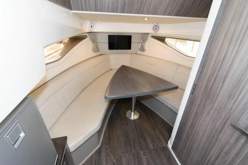 Slide: The Image of Interior of 2020 Sea Ray Sundancer 320 with modern seating and table. - 18