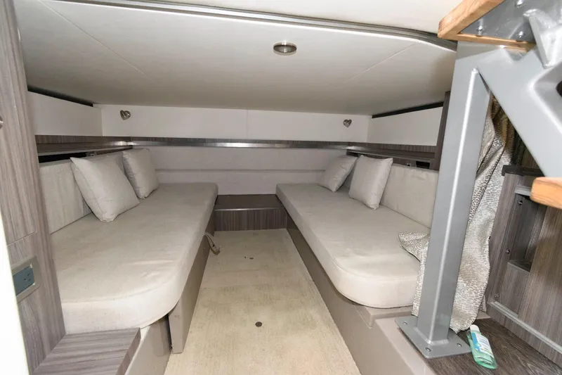 Slide: The Image of 2020 Sea Ray Sundancer 320 cabin interior with twin beds and modern design. - 19