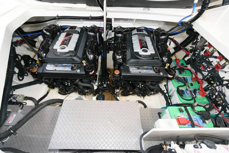 Slide: The Image of Engine room of 2020 Sea Ray Sundancer 320 with dual engines and batteries. - 22