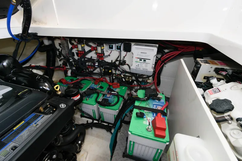 Slide: The Image of Engine compartment of 2020 Sea Ray Sundancer 320 with batteries and wiring. - 24