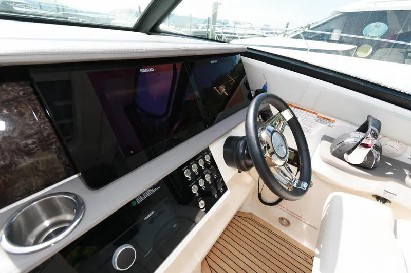 Slide: The Image of 2020 Sea Ray Sundancer 320 helm with modern controls and sleek design. - 9