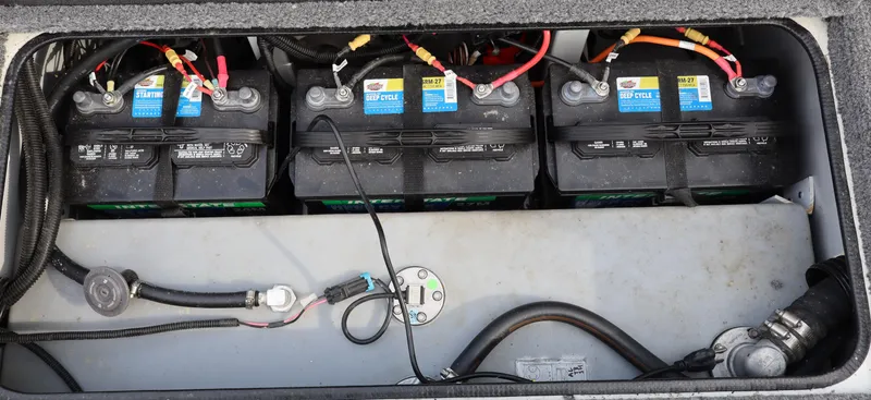 Slide: The Image of Three marine batteries in a 2022 Ranger RT178 boat compartment. - 11