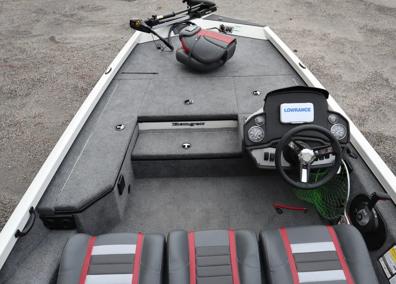 Slide: The Image of 2022 Ranger RT178 boat interior with steering console, seating, and fishing equipment. - 8