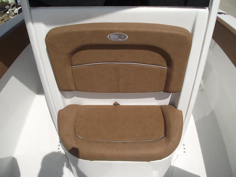 Slide: The Image of 2024 Sea Hunt Ultra 239 SE boat seating with brown cushions. - 14