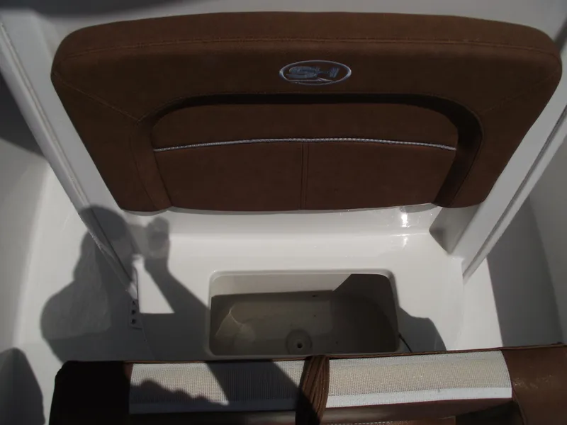 Slide: The Image of 2024 Sea Hunt Ultra 239 SE boat seat with storage compartment. - 15