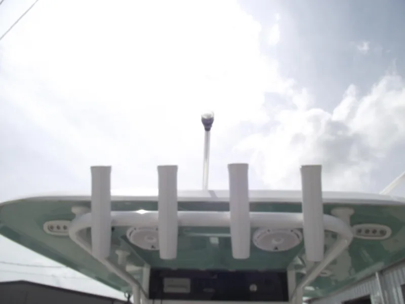 Slide: The Image of 2024 Sea Hunt Ultra 239 SE boat top view with rod holders and antenna. - 21