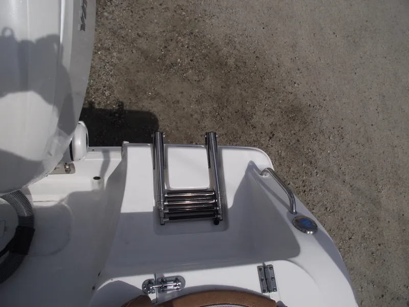 Slide: The Image of 2024 Sea Hunt Ultra 239 SE boat ladder and deck detail. - 30