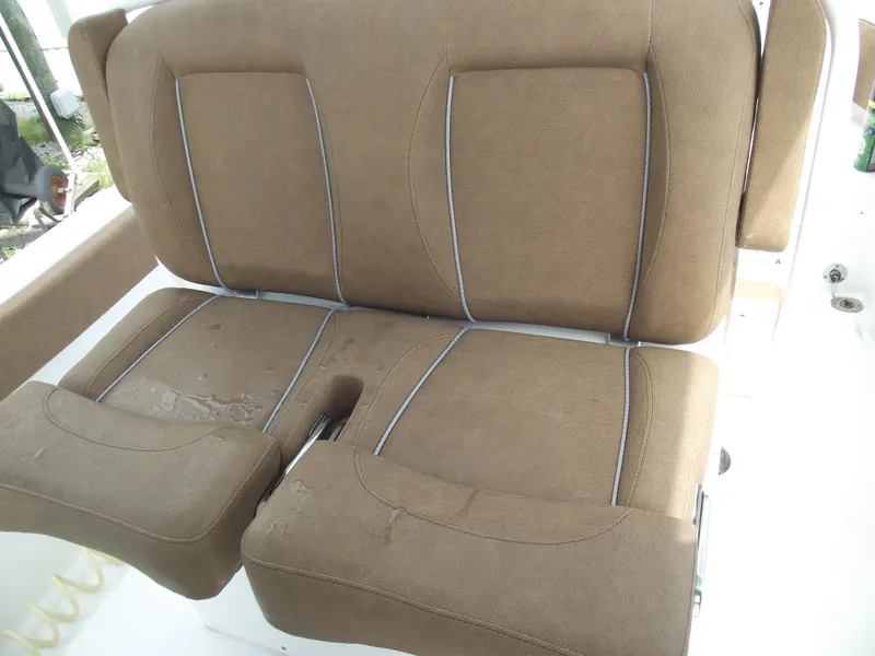 Slide: The Image of 2024 Sea Hunt Ultra 239 SE boat seat, brown upholstery, dual seating. - 32