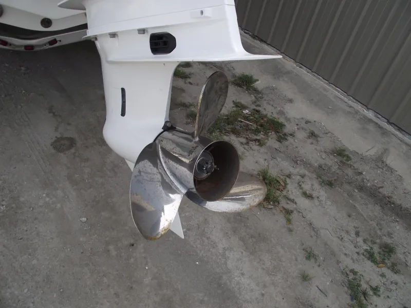 Slide: The Image of Propeller of 2024 Sea Hunt Ultra 239 SE boat on a concrete surface. - 4